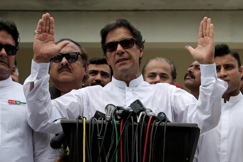 FILE PHOTO: Cricket star-turned-politician Imran Khan, chairman of Pakistan Tehreek-e-Insaf (PTI), speaks after voting in the general election in Islamabad
