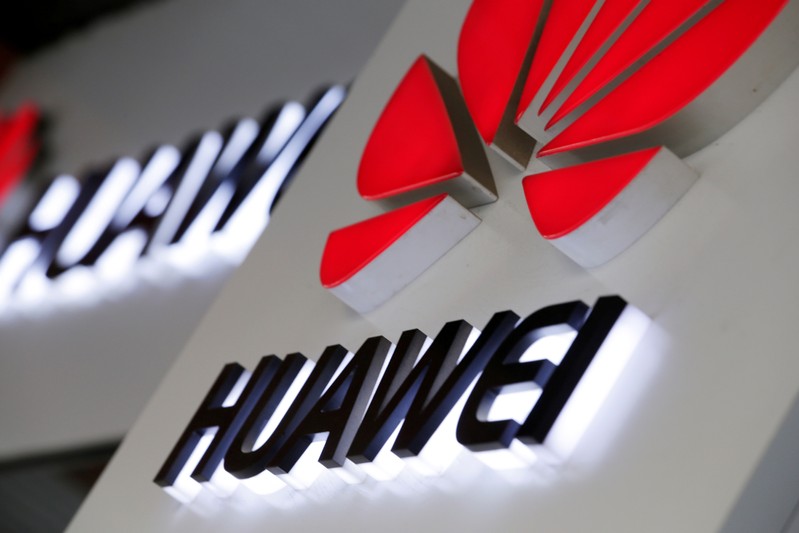 FILE PHOTO: Logos of Huawei are pictured outside its shop in Beijing