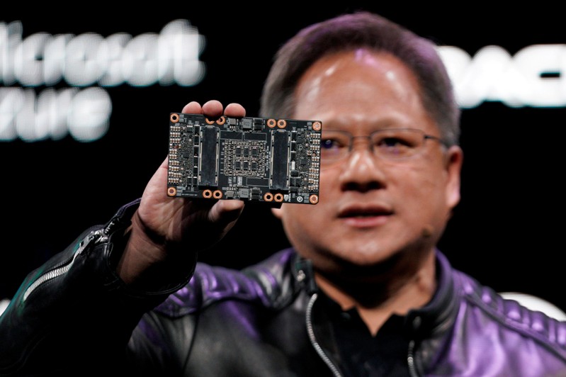 FILE PHOTO: Jensen Huang, CEO of Nvidia, shows the NVIDIA Volta GPU computing platform at his keynote address at CES in Las Vegas