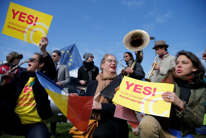 Demonstrators take part in a protest in front of the European Parliament as MEPs debate on modifications to EU copyright reforms in Strasbourg