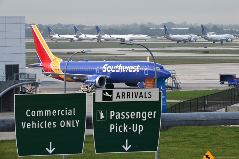 FILE PHOTO: A Southwest Airlines Boeing 737 MAX 8 aircraft is pictured in front of United Airlines planes, including Boeing 737 MAX 9 models, at William P. Hobby Airport in Houston