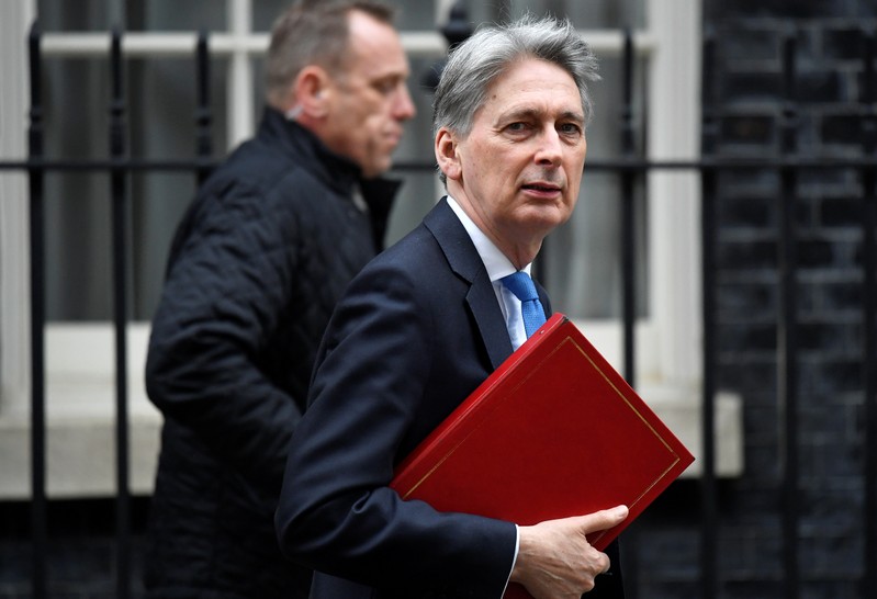 Britain's Chancellor of the Exchequer Philip Hammond is seen outside Downing Street in London