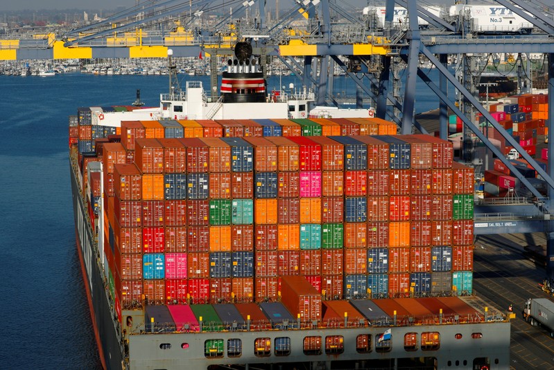FILE PHOTO: Shipping containers are pictured stacked on a ship docked at Yusen Terminals at the Port of Los Angeles