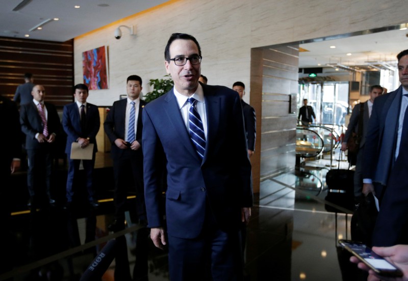 FILE PHOTO: U.S. Treasury Secretary Steven Mnuchin, a member of the U.S. trade delegation, speaks to the media upon his arrival at a hotel in Beijing