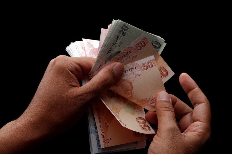 Turkish lira banknotes are seen in this picture illustration in Istanbul