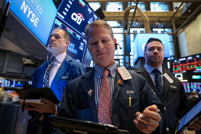 Traders work on the floor of the NYSE in New York