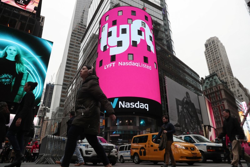 Signage for Lyft is seen displayed at the NASDAQ MarketSite in Times Square in celebration of its initial public offering (IPO) on the NASDAQ Stock Market in New York
