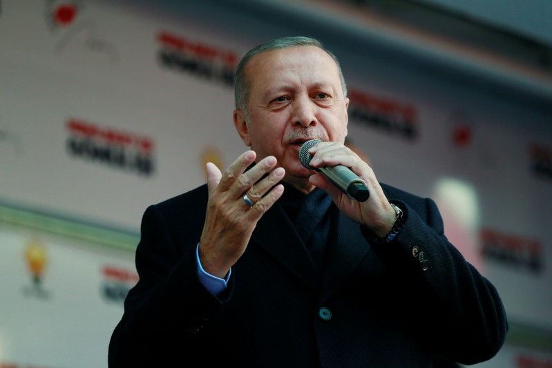 Turkish President Erdogan addresses his supporters during a rally for the upcoming local elections, in Ankara