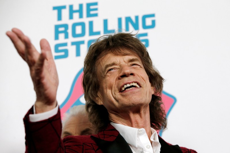 FILE PHOTO: Mick Jagger of The Rolling Stones poses for photographers as the band arrives for the opening of the new exhibit