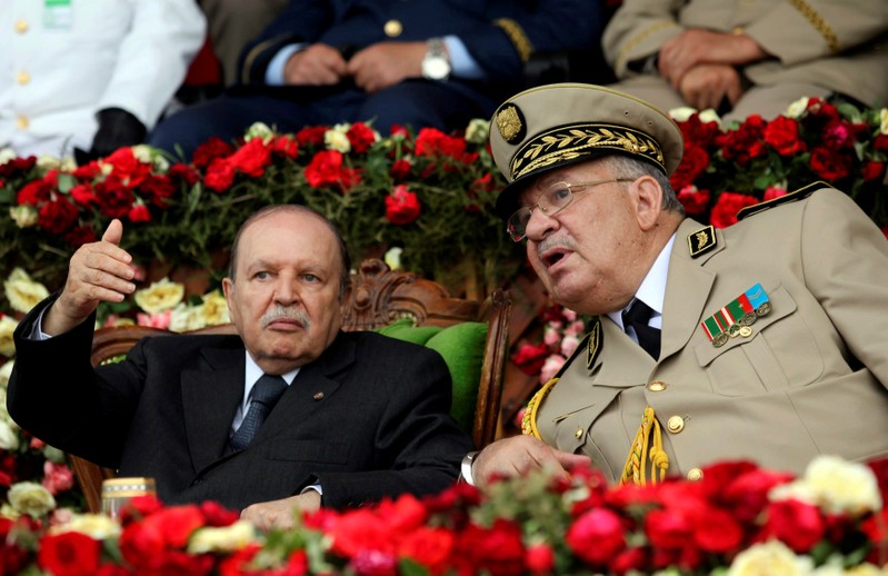 FILE PHOTO: Algeria's President Abdelaziz Bouteflika gestures during a graduation ceremony of the 40th class of the trainee army officers at a Military Academy in Cherchell