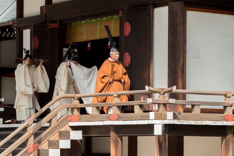 Japan's Emperor Akihito walks for a ritual at the Imperial Palace in Tokyo