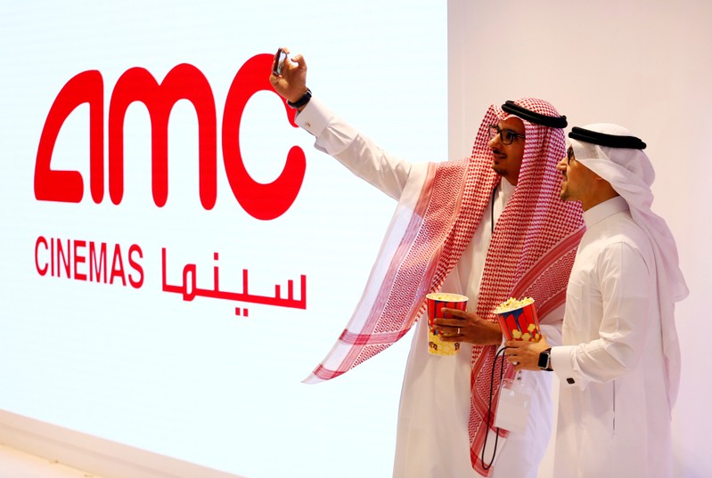 FILE PHOTO: Two Saudi men take a selfie at Saudi Arabia's first commercial movie theater in Riyadh