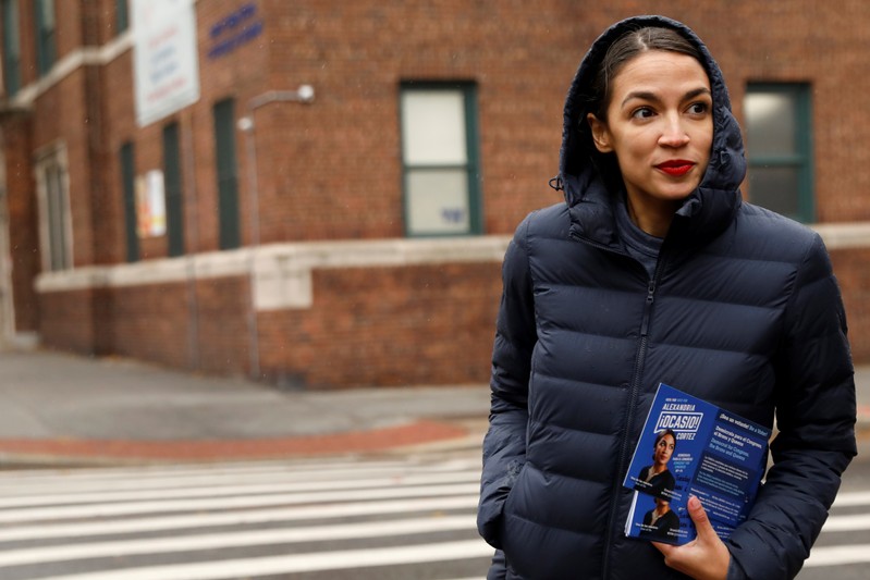FILE PHOTO - Democratic Congressional candidate Alexandria Ocasio-Cortez campaigns during a whistle stop in the Queens borough of New York City, New York