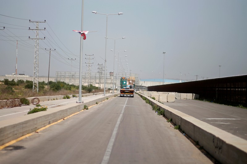 Truck carrying crates containing animals leaves Gaza after the animals were taken out of a Gaza zoo by FOUR PAWS organization, at Israeli Erez crossing in the northern Gaza Strip