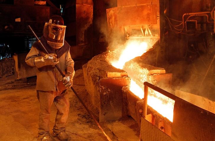 FILE PHOTO: A worker monitors a process inside the plant at the copper refinery of Codelco Ventanas in Ventanas