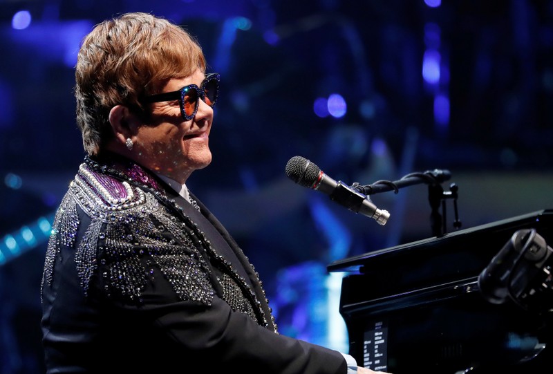 Elton John performs during his