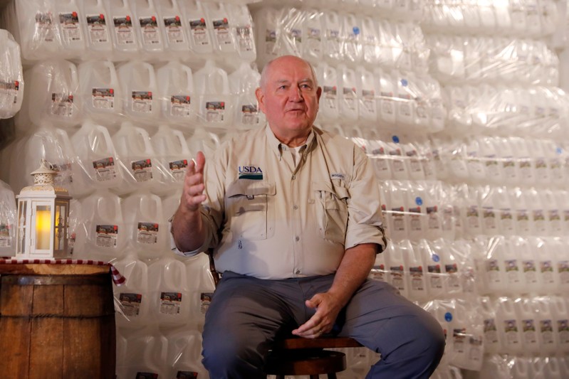 FILE PHOTO: U.S. Agriculture Secretary Sonny Perdue speaks to dairy farmers at Trinity Valley Dairy in Cortland