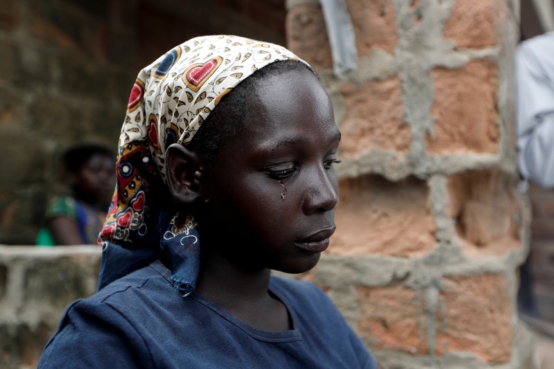The Wider Image: Lives washed away: A mother's loss in Mozambique