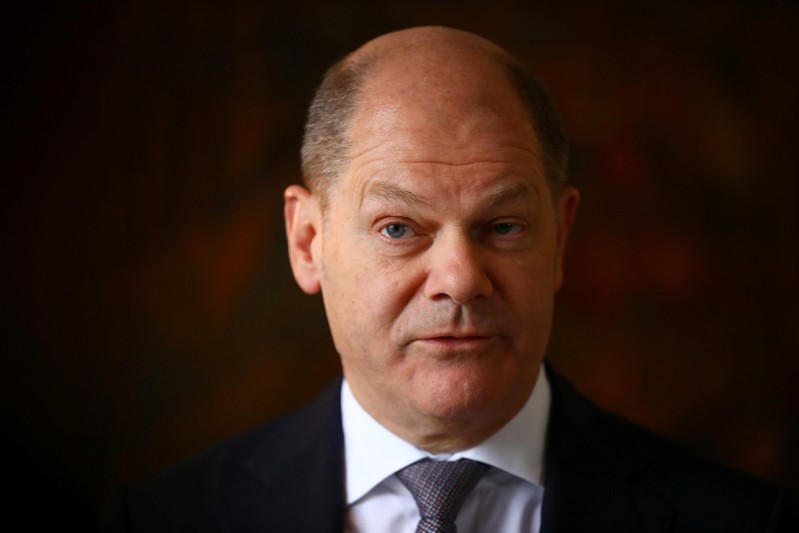FILE PHOTO: German Finance Minister Olaf Scholz attends a Reuters interview in Berlin