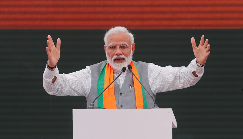 FILE PHOTO: Indian Prime Minister Narendra Modi gestures as he speaks after releasing BJP's election manifesto for the April/May general election, in New Delhi