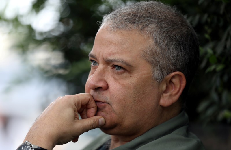 FILE PHOTO: Peruvian journalist Pedro Salinas, who exposed a web of abuse in an elite Catholic society and is being sued for defamation by a local bishop, talks to Reuters during an interview in Lima
