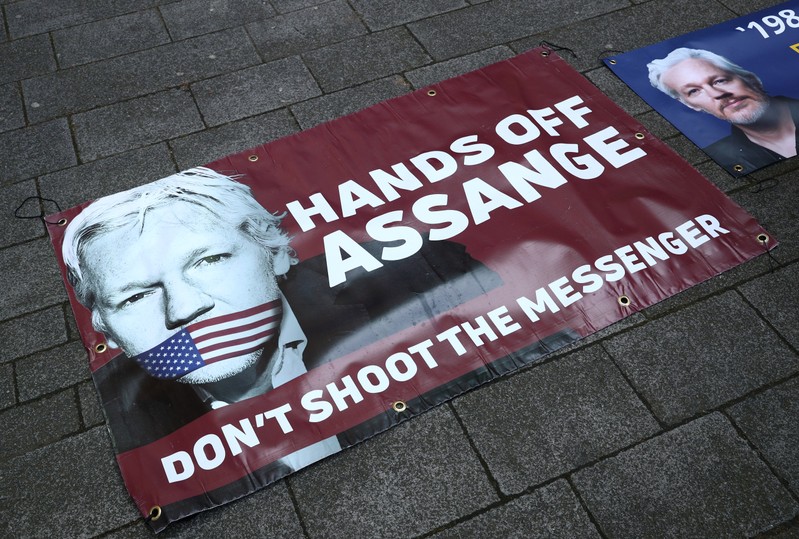 Banners in support of arrested WikiLeaks founder Julian Assange are seen on the pavement in front of Westminster Magistrates Court in London