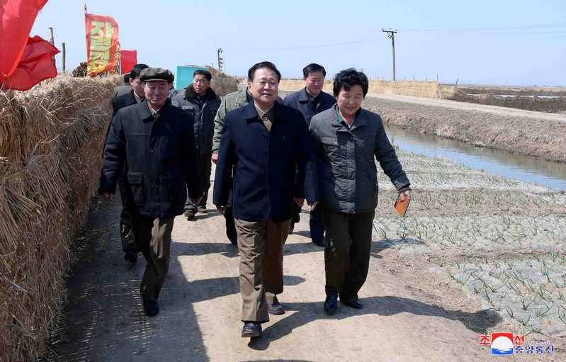 FILE PHOTO - KCNA picture of Choe Ryong Hae, vice-chairman of the central committee of the Workers' Party of Korea (WPK), inspecting a farm in Sariwon