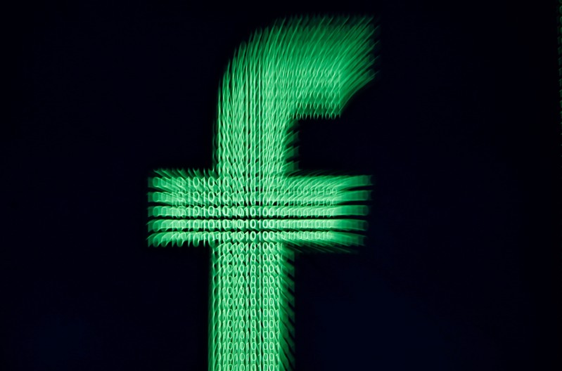 FILE PHOTO: A 3D-printed Facebook logo is displayed in front of binary digits in this illustration