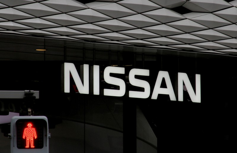 FILE PHOTO : The logo of Nissan Motor Co. is seen at its show room behind a traffic sign in Tokyo