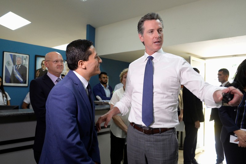 FILE PHOTO: Governor of U.S. state of California Gavin Newsom visits the premises of a migrant assistance office in San Salvador