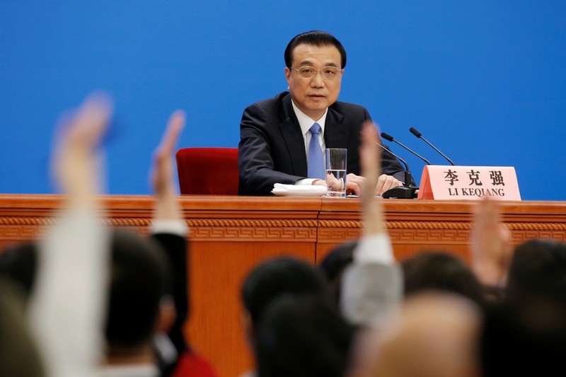 Chinese Premier Li Keqiang attends a news conference following the closing session of the National People's Congress (NPC) at the Great Hall of the People in Beijing