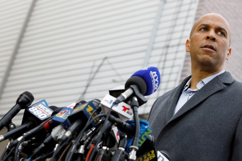 FILE PHOTO: U.S. Senator Corey Booker (D-NJ) speaks to the media outside his home after announcing he will run for president in Newark, New Jersey