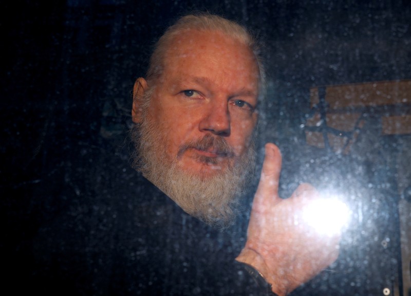 FILE PHOTO: WikiLeaks founder Julian Assange is seen as he leaves a police station in London