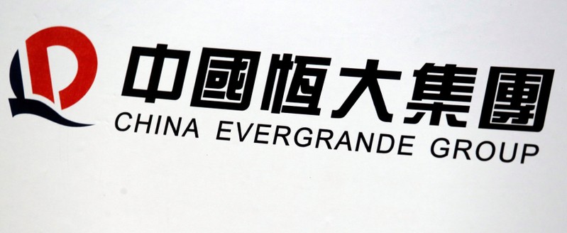 A logo of China Evergrande Group is displayed at a news conference on the property developer's annual results in Hong Kong