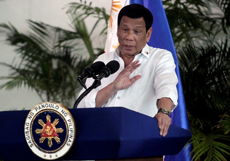 FILE PHOTO: President Rodrigo Duterte speaks after his arrival in Davao