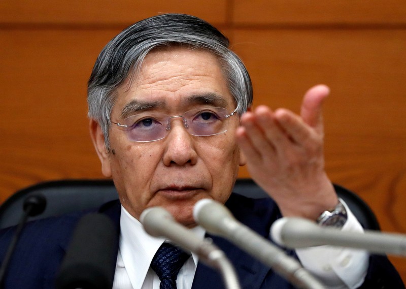 FILE PHOTO : Bank of Japan Governor Haruhiko Kuroda attends a news conference at the BOJ headquarters in Tokyo
