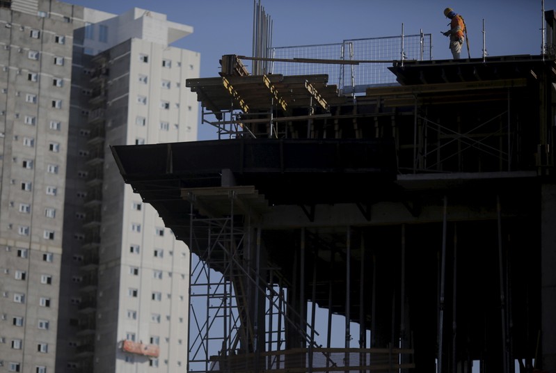Employee works at a construction site for a residential building in Sao Paulo