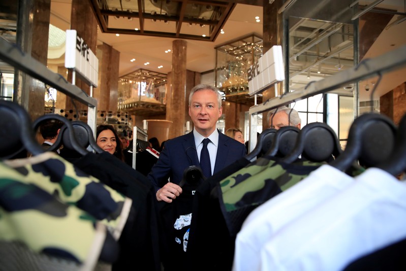 FILE PHOTO: French Finance and Economy Minister Bruno Le Maire visits the new Galeries Lafayette flaghip store on the Champs Elysees avenue in Paris