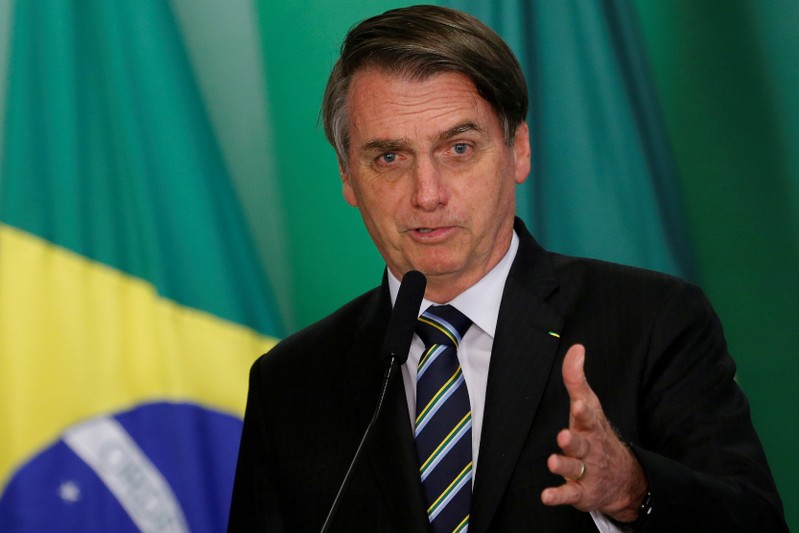 FILE PHOTO: FILE PHOTO: Brazil's President Jair Bolsonaro speaks during inauguration ceremony of the new Education Minister Abraham Weintraub at the Planalto Palace in Brasilia