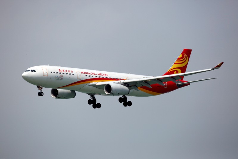 FILE PHOTO: A Hong Kong Airlines Airbus A330-343 descends before landing at Hong Kong Airport in Hong Kong