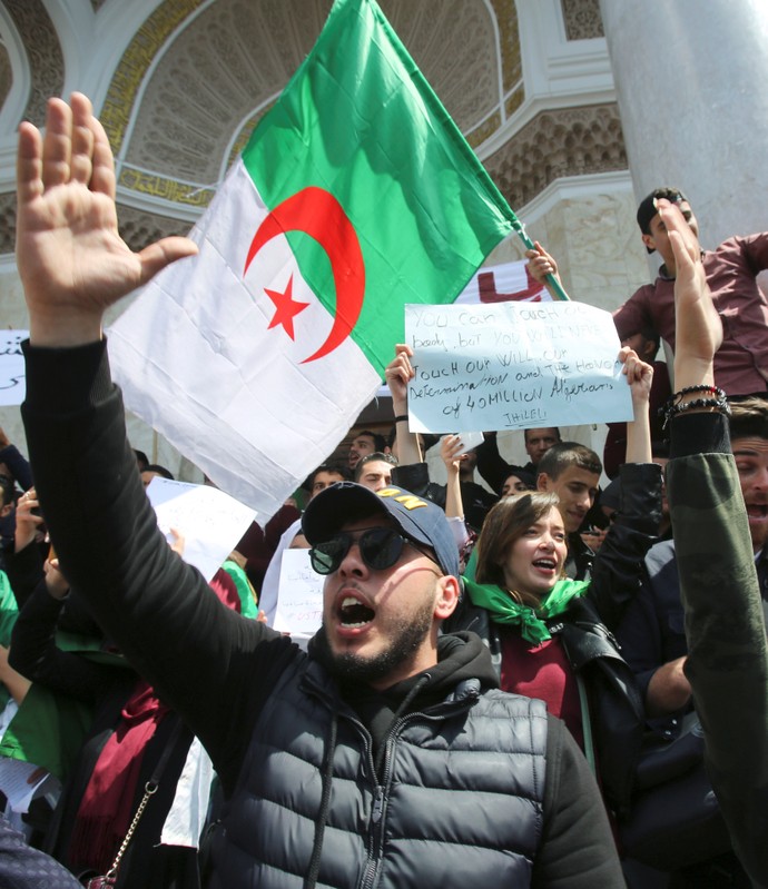 A student gestures during a protest seeking the departure of the ruling elite in Algiers