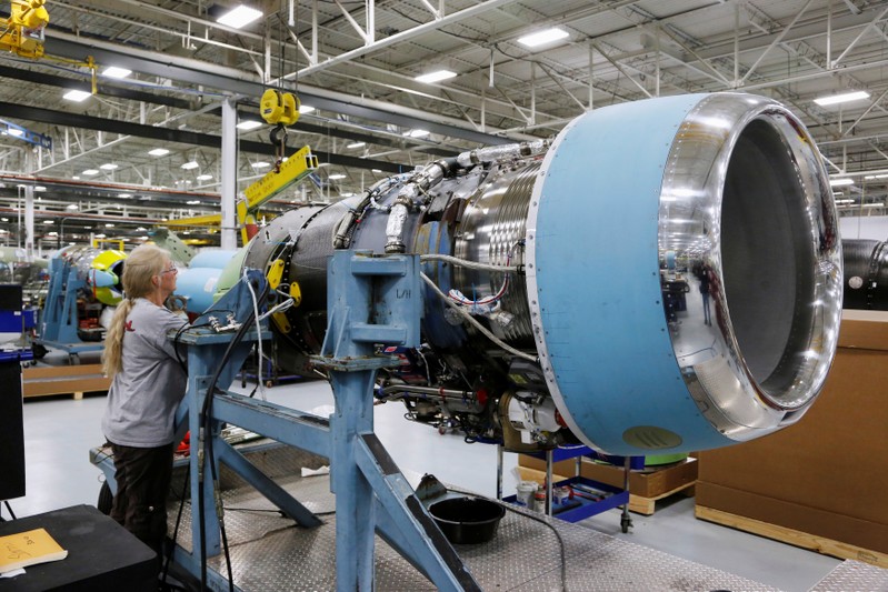 FILE PHOTO: Cessna employee Lee York works on an engine of a Cessna business jet at the assembly line at their manufacturing plant in Wichita