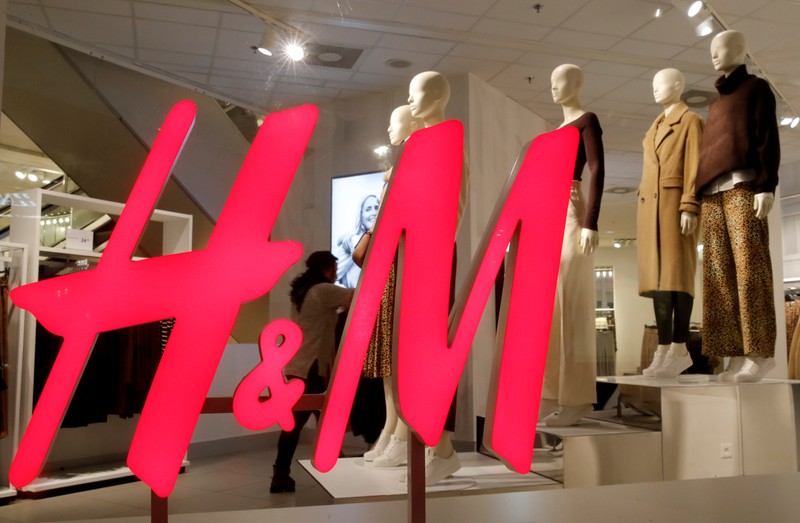 FILE PHOTO: Logo of H&M is seen in a display window of a store in Zurich, Switzerland
