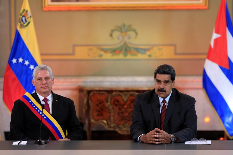 Venezuela's President Nicolas Maduro speaks next to Cuba's President Miguel Diaz-Canel during their meeting at the Miraflores Palace in Caracas