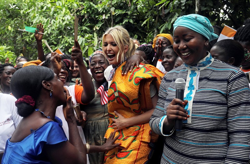 White House Advisor Ivanka Trump dances as she meets women entrepreneurs, at the demonstration cocoa farm in Adzope