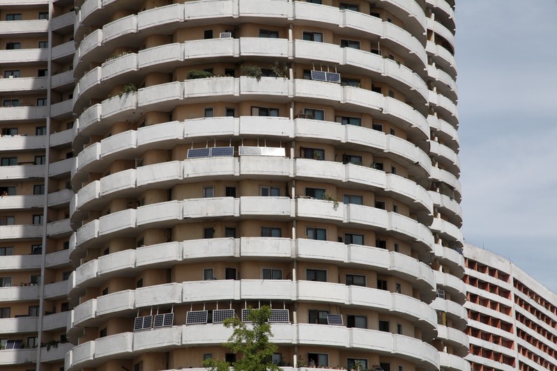 FILE PHOTO: Solar panels face the sun from balconies of an apartment building in Pyongyang