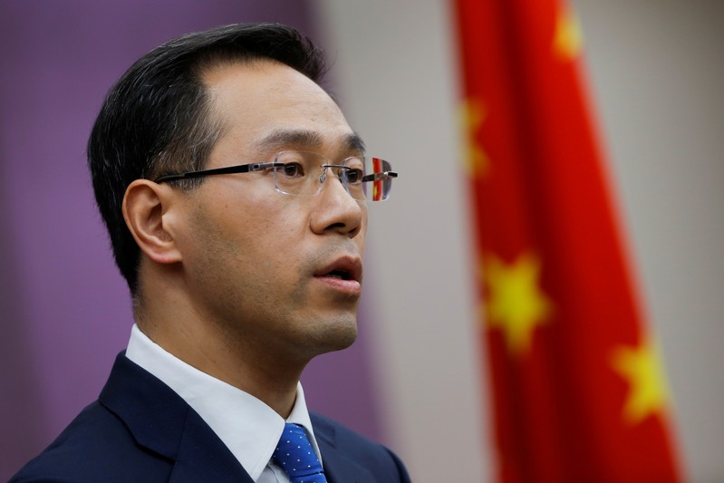 FILE PHOTO: China's Ministry of Commerce spokesperson Gao Feng attends a news conference in Beijing