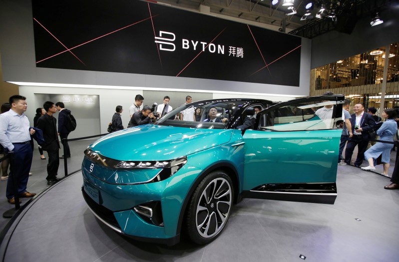 FILE PHOTO: A man checks a Byton Concept T car at the Auto China 2018 motor show in Beijing
