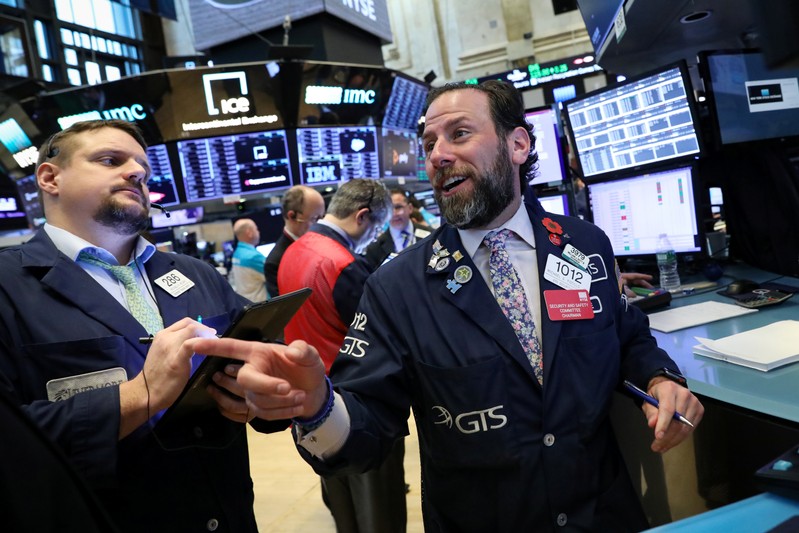 Traders work on the floor at the NYSE in New York