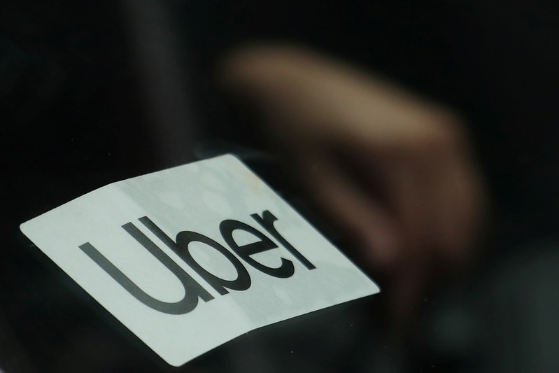 Uber sign is seen on a car in New York